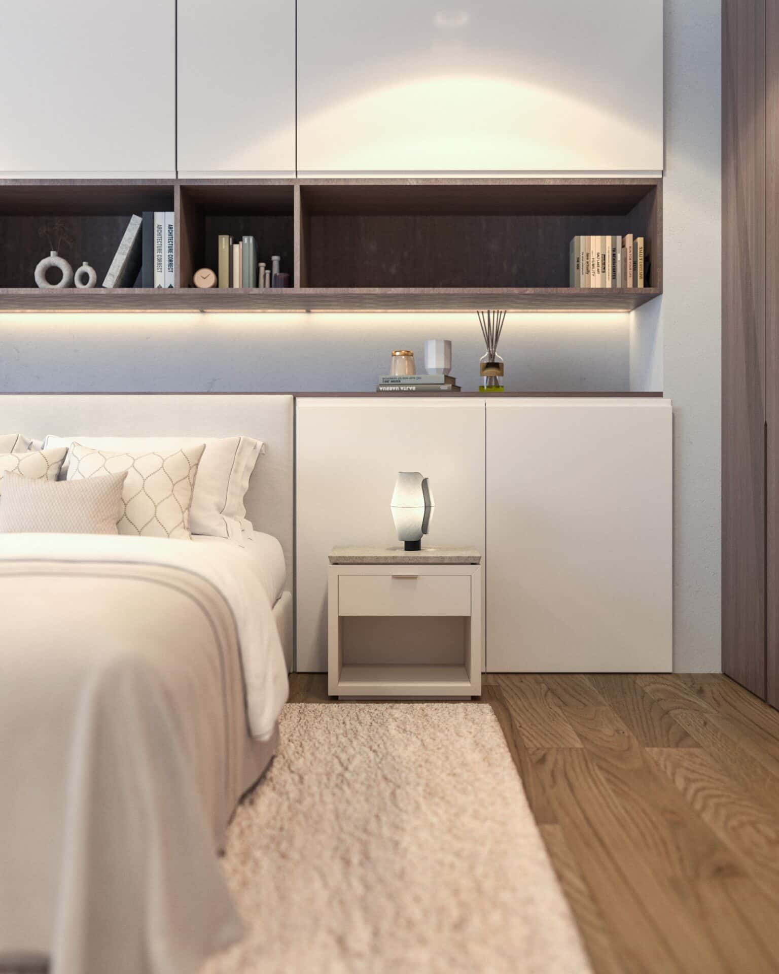 a bed with a white bed and a white nightstand