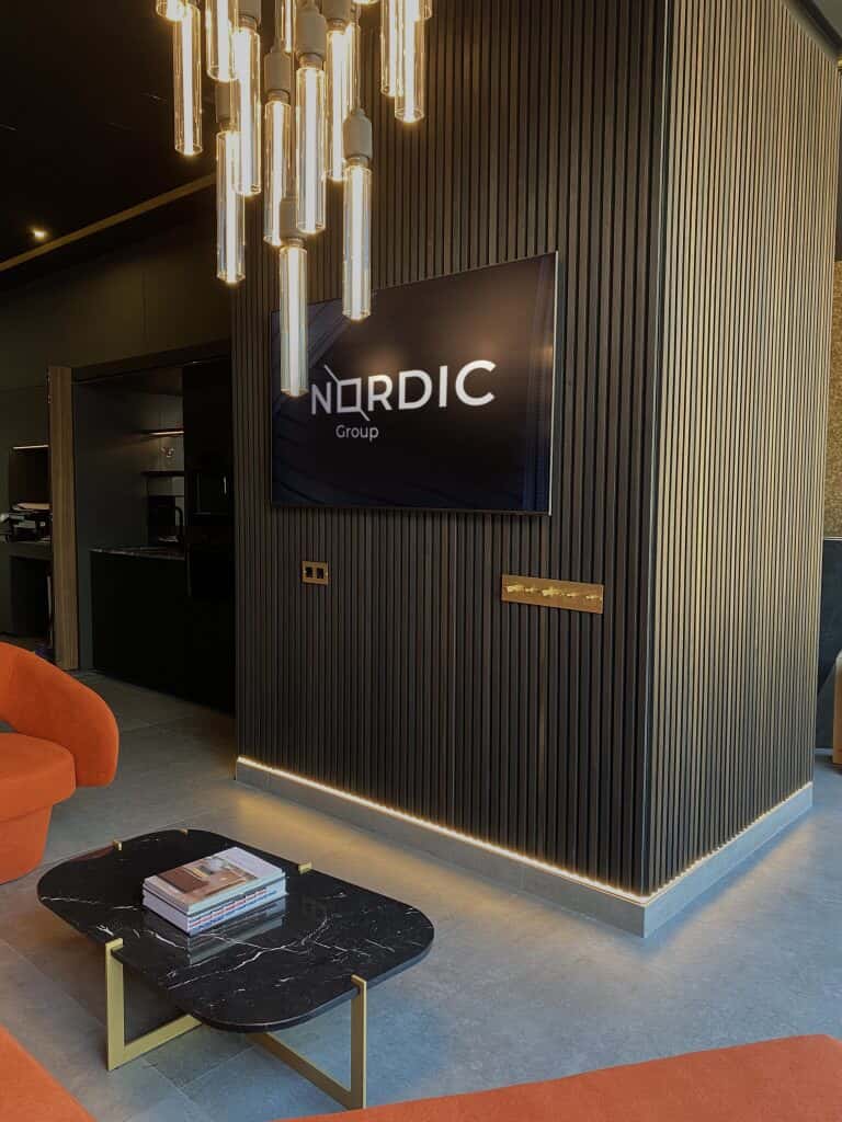 a room with a tv and a coffee table