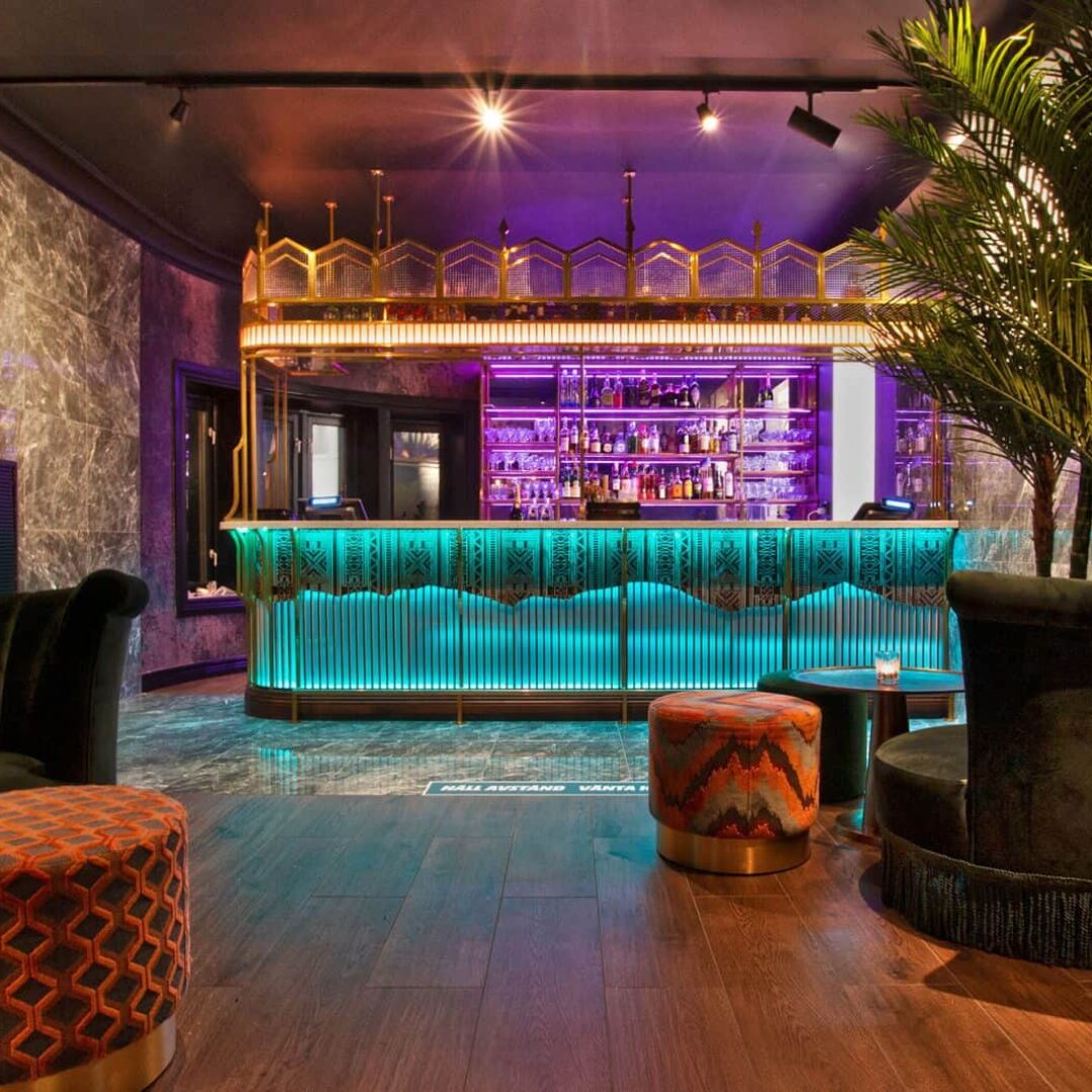 a bar with a bar and a palm tree